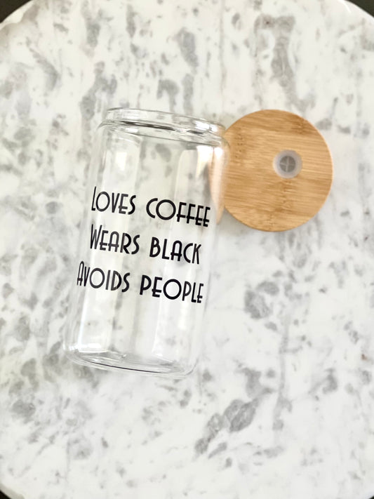 loves coffee, wears black, avoids people coffee cup